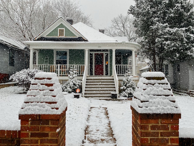 suburban house covered in fresh snow
